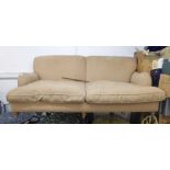 MODERN, FULLY UPHOLSTERED FOUR SEATER SETTEE with two loose cushions, on turned forelegs with