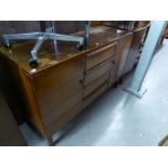 A MID TWENTIETH CENTURY OAK CUPBOARD OVER TWO DRAWERS AND THE MATCHING SMALL SIDEBOARD