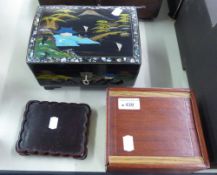 AN ORIENTAL BLACK LACQUER MUSICAL LADY'S TRINKET BOX, AN EASTERN HARDWOOD GAME BOX, AND A WOODEN