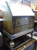 JACOBEAN STYLE OAK BUREAU, WITH TWO LONG DRAWERS AND AN OAK PEMBROKE TEA TROLLEY (2)