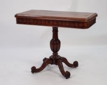 EARLY NINETEENTH CENTURY CARVED AND FIGURED MAHOGANY PEDESTAL TEA TABLE, the rounded oblong fold-