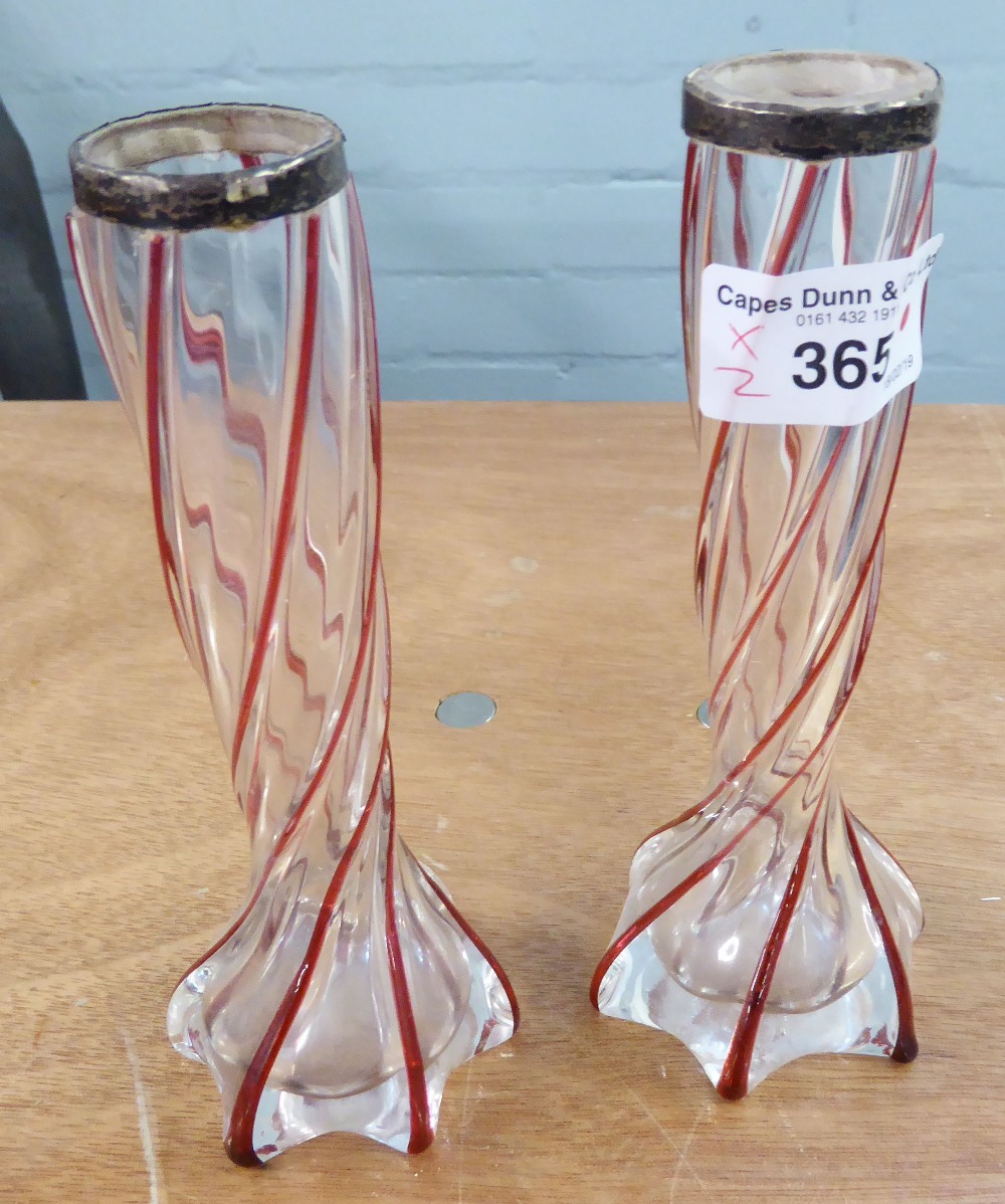 PAIR OF EARLY 20TH CENTURY TWIST STEM GLASS VASES HAVING SILVER RIMS (A/F), THE CLEAR GLASS HAVING