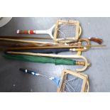 A 'WISDEN' TENNIS RACKET, TWO BADMINTON RACKETS, WALKING STICKS AND UMBRELLAS