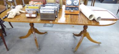 A REPRODUCTION MAHOGANY TWIN PILLAR DINING TABLE