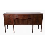 SHERATON REVIVAL CROSSBANDED AND LINE INLAID FIGURED MAHOGANY SERPENTINE FRONTED LARGE SIDEBOARD,