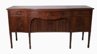 SHERATON REVIVAL CROSSBANDED AND LINE INLAID FIGURED MAHOGANY SERPENTINE FRONTED LARGE SIDEBOARD,