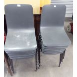 A SET OF 12 PLASTIC STACKING CHAIRS
