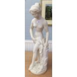 MODERN RECONSTITUTED MARBLE CLASSICAL FIGURINE OF A MAIDEN, HOLDING A CLOTH AND RAISED ON CIRCULAR