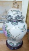 MODERN LARGE CHINESE GINGER JAR AND COVER, ON TURNED WOODEN STAND, 50cm HIGH