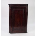 GEORGE III MAHOGANY FLAT FRONTED CORNER CUPBOARD, the moulded cornice above a crossbanded and