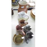 THREE VARIOUS SIZED STUDIO POTTERY JUGS AND FOUR POTTERY TANKARDS