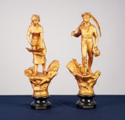 PAIR OF EARLY TWENTIETH CENTURY FRENCH GILT SPELTER FIGURES, 'L'AGRICULTURE', each on an ebonised