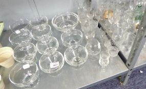 A QUANTITY OF DRINKING GLASSES AND A GLASS DECANTER