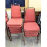 A SET OF 10 STACKING CHAIRS WITH RED FABRIC BACKS AND SEATS (10)