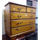 A PINE CHEST OF TWO SHORT AND TWO LONG DRAWERS AND A PINE WARDROBE WITH TWO PLANKED DOORS (2)