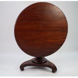 EARLY NINETEENTH CENTURY MAHOGANY BREAKFAST TABLE, the moulded circular snap top above a heavy