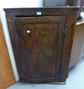 VICTORIAN OAK CORNER CUPBOARD HAVING SOLID PANEL DOOR ENCLOSED THREE SHAPED SHELVES