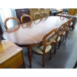 A GOOD QUALITY MAHOGANY REPRODUCTION DINING TABLE WITH TWO EXTRA LEAVES AND A SET OF TEN DINING