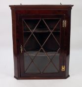 ANTIQUE FLAT FRONTED GLAZED MAHOGANY CORNER CUPBOARD, with exposed brass butterfly hinges, fancy