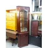 MAHOGANY DOUBLE CORNER CUPBOARD WITH SINGLE GLAZED DOOR ENCLOSING A MIRRORED INTERIOR WITH THREE