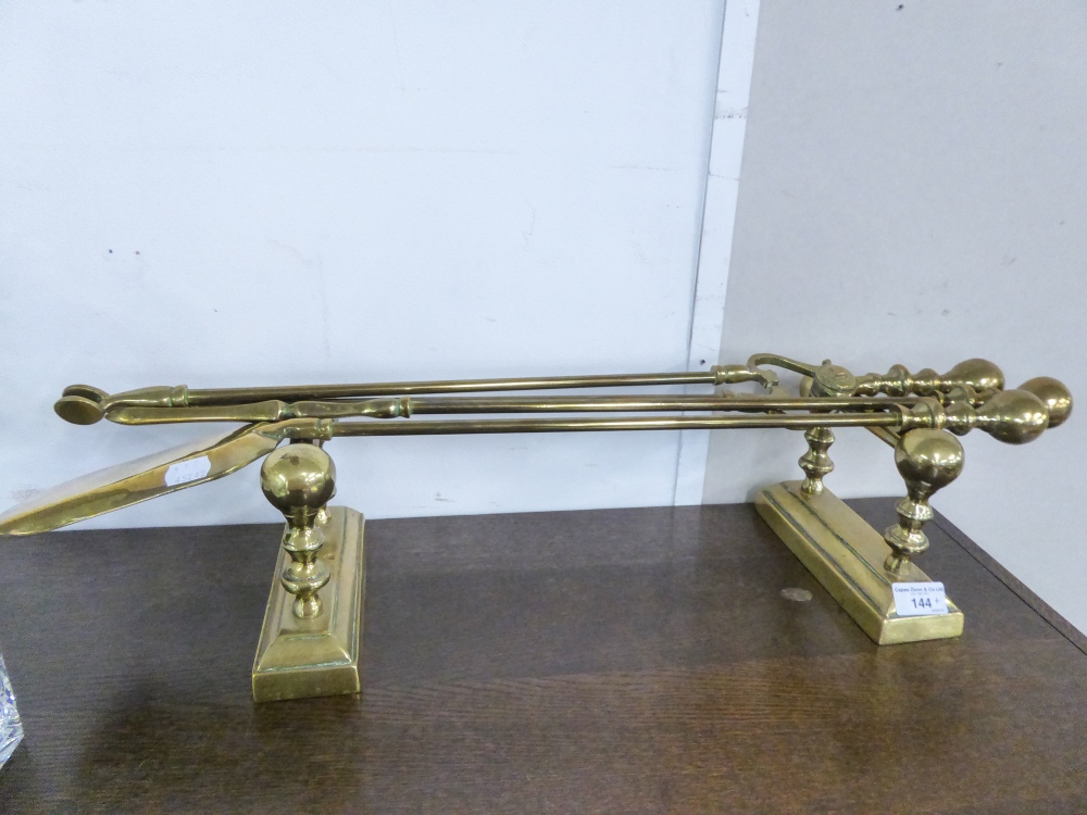 GROUP OF BRASS FIRE IRONS AND STAND