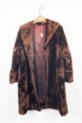 LADY'S LUSTROUS BROWN BEAVER LAMB FULL LENGTH COAT, with broad shawl collar, hook fastening front,
