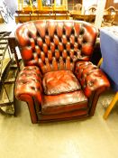 CHESTERFIELD STYLE WINGED ARMCHAIR COVERED IN RED LEATHER