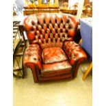 CHESTERFIELD STYLE WINGED ARMCHAIR COVERED IN RED LEATHER