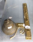 A BRASS SHIPS BELL, A BRASS WALL RACK WITH FOUR HOOKS, A BRASS COAT HOOK WITH THREE SWINGING ARMS