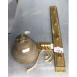 A BRASS SHIPS BELL, A BRASS WALL RACK WITH FOUR HOOKS, A BRASS COAT HOOK WITH THREE SWINGING ARMS