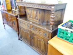 OAK COURT CUPBOARD WITH CARVED DECORATION TO DOORS AND DRAWERS, TOP SECTION WITH TWO TURNED COLUMNS