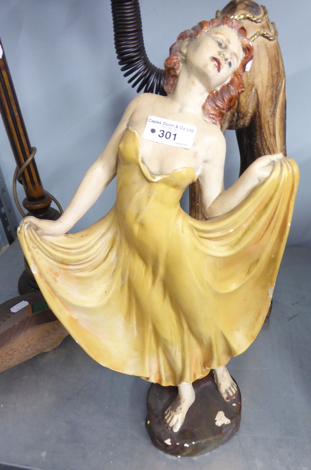 A 1930'S PAINTED PLASTER FIGURE OF A FEMALE DANCING