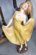 A 1930'S PAINTED PLASTER FIGURE OF A FEMALE DANCING