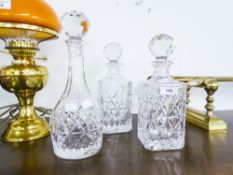 THREE CUT GLASS/CRYSTAL DECANTERS, TWO SQUARE EXAMPLES AND A CIRCULAR ONE (3)