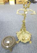 CAST BRASS STICK STAND, modelled with dog, gun and dead game, 23" high, and a CAST IRON CIRCULAR