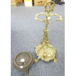 CAST BRASS STICK STAND, modelled with dog, gun and dead game, 23" high, and a CAST IRON CIRCULAR