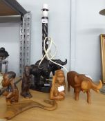 AFRICAN CARVED EBONY TABLE LAMP WITH TWO CARVED OXEN TO THE OVAL BASE, together with THREE CARVED