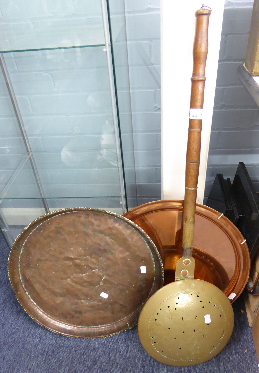 TWO BRASS LARGE CIRCULAR TRAYS AND A BED WARMING PAN (3)