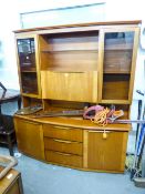 SAKOL, TEAK MID TWENTIETH CENTURY SIDEBOARD, HAVING RAISED BACK WITH GLAZED END CABINETS, THE BASE