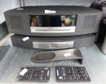 BOSE 'WAVE MUSIC SYSTEM' WITH RADIO AND CD PLAYER AND REMOTE CONTROLS AND STANDING ON ITS