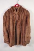 LADY'S MUSQUASH BROWN FUR with collarless round neck, hook fastening front