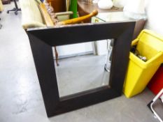 A LARGE RECTANGULAR BEVELLED EDGE WALL MIRROR IN BROAD PLAIN WOODEN FRAME