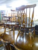 SET OF SIX HARDWOOD COMB BACKED WINDSOR DINING CHAIRS WITH PANEL SEATS, INCLUDING THE CARVER'S