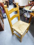 SET OF FOUR CHUNKY PINE DINING CHAIRS AND A SET OF FOUR FAUX LEATHER DINING CHAIRS