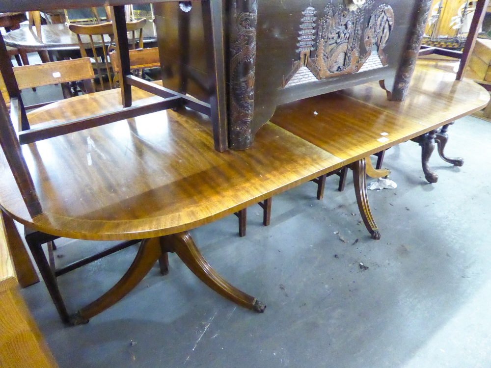 A REPRODUCTION MAHOGANY TWIN PILLAR DINING TABLE