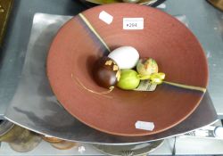 A STUDIO POTTERY SHALLOW CIRCULAR BOWL WITH TWO STONE 'EGGS' AND A HAND MADE ALUMINIUM