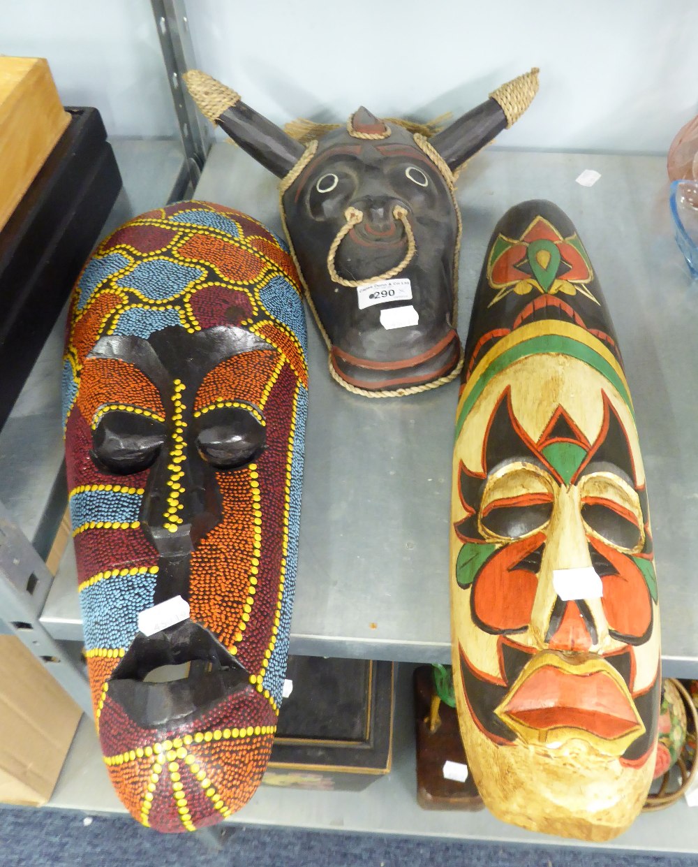 A LARGE AFRICAN BEADWORK DECORATED WALL MASK, AFRICAN LONG WOODEN WALL MASK AND AN AFRICAN BLACK