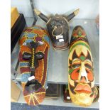 A LARGE AFRICAN BEADWORK DECORATED WALL MASK, AFRICAN LONG WOODEN WALL MASK AND AN AFRICAN BLACK