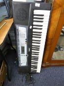 A YAMAHA E214 ELECTRONIC KEYBOARD