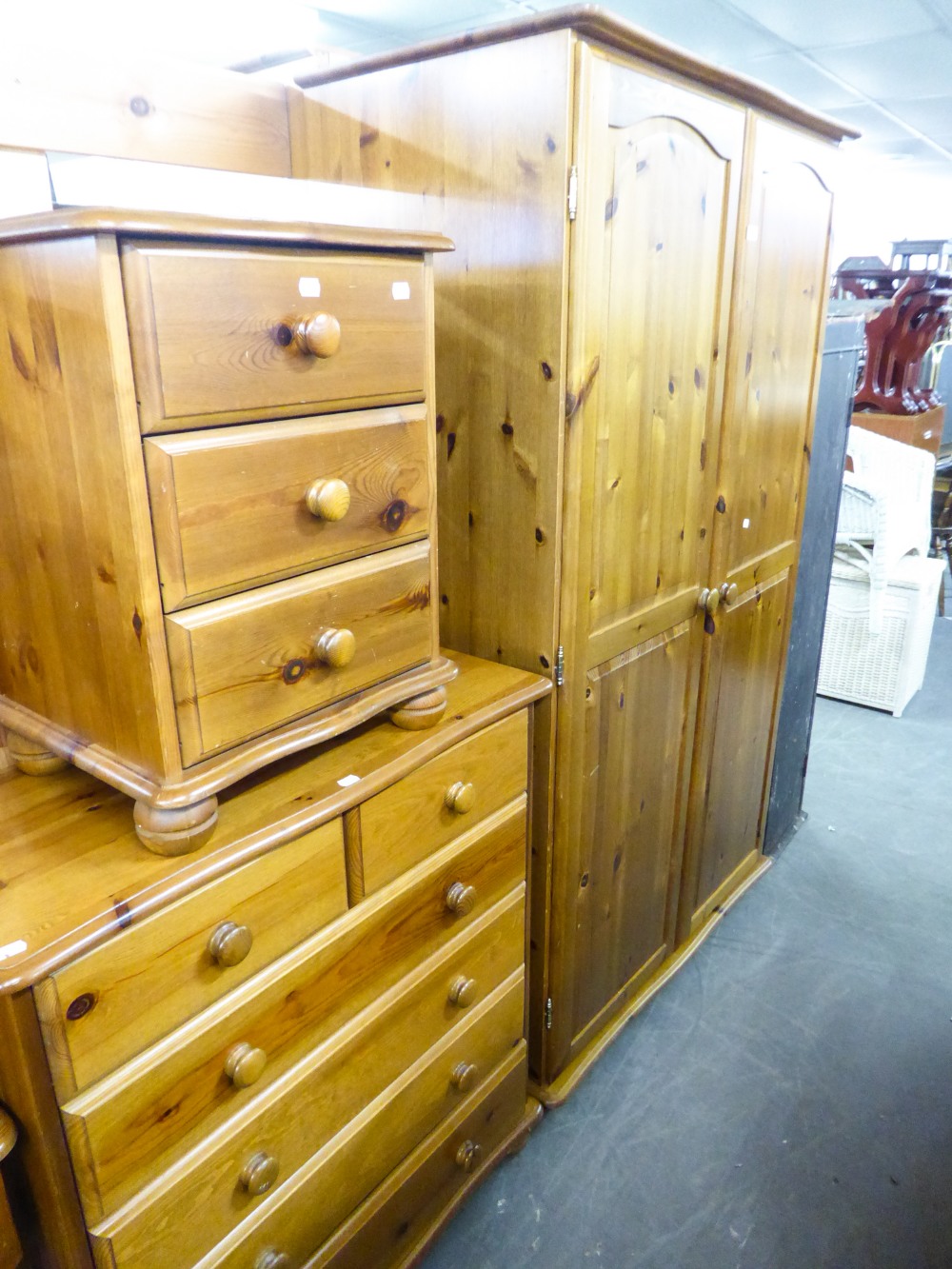 PINE DOUBLE WARDROBE; A PINE DOUBLE BEDSTEAD WITH FRAME; A PINE CHEST OF TWO SHORT OVER FOUR LONG